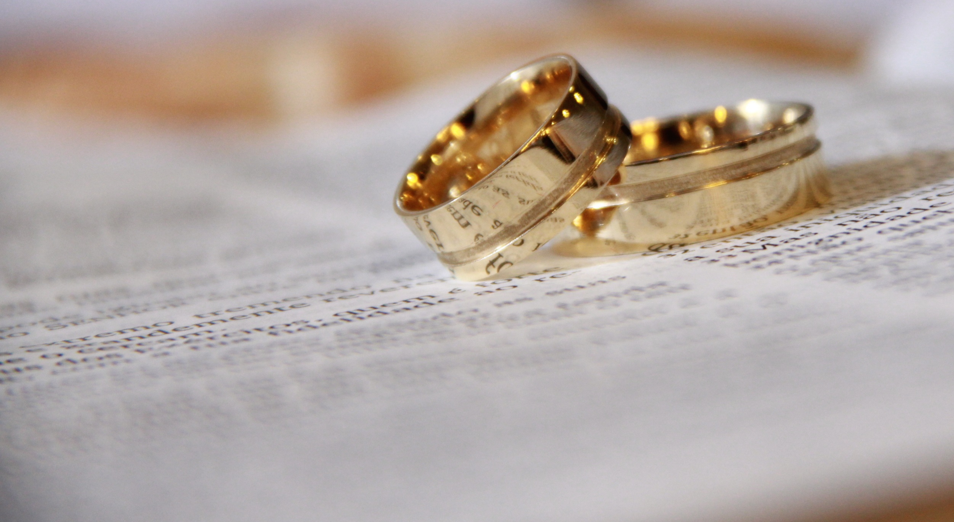 TWO WEDDING RINGS ON A BIBLE
